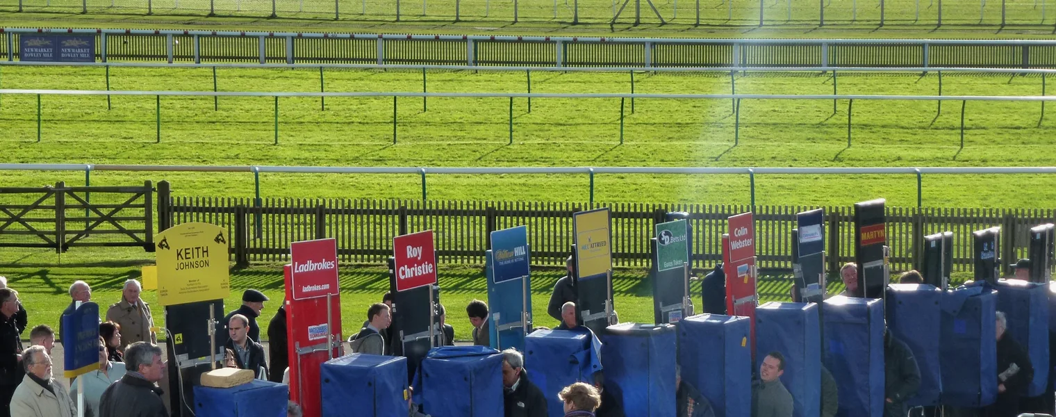 Behind the bookmakers boards at the Rowley Mile, Newmarket