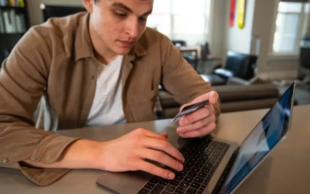Paying by card on a laptop